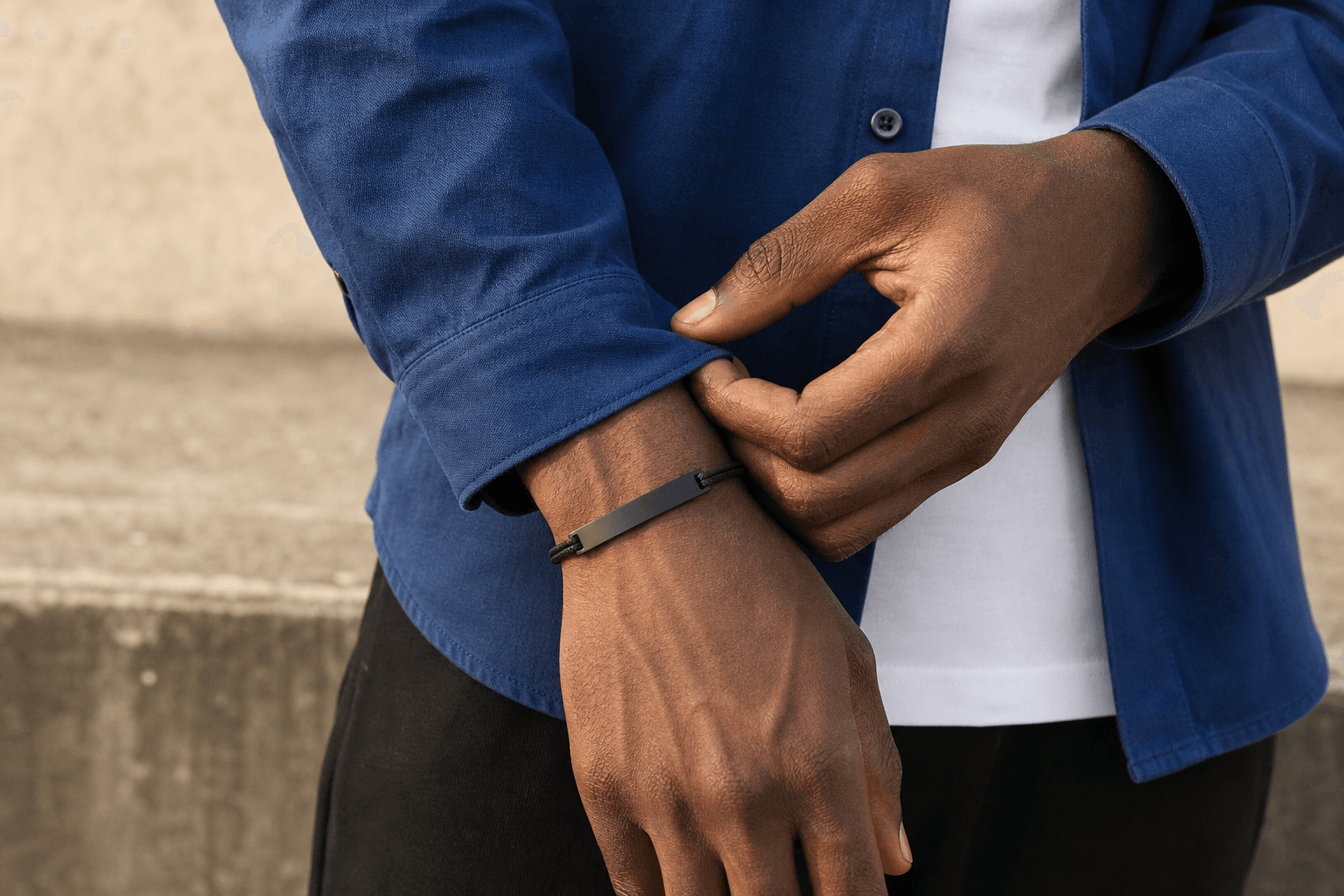 Demo model wearing a matte-black personalised bracelet