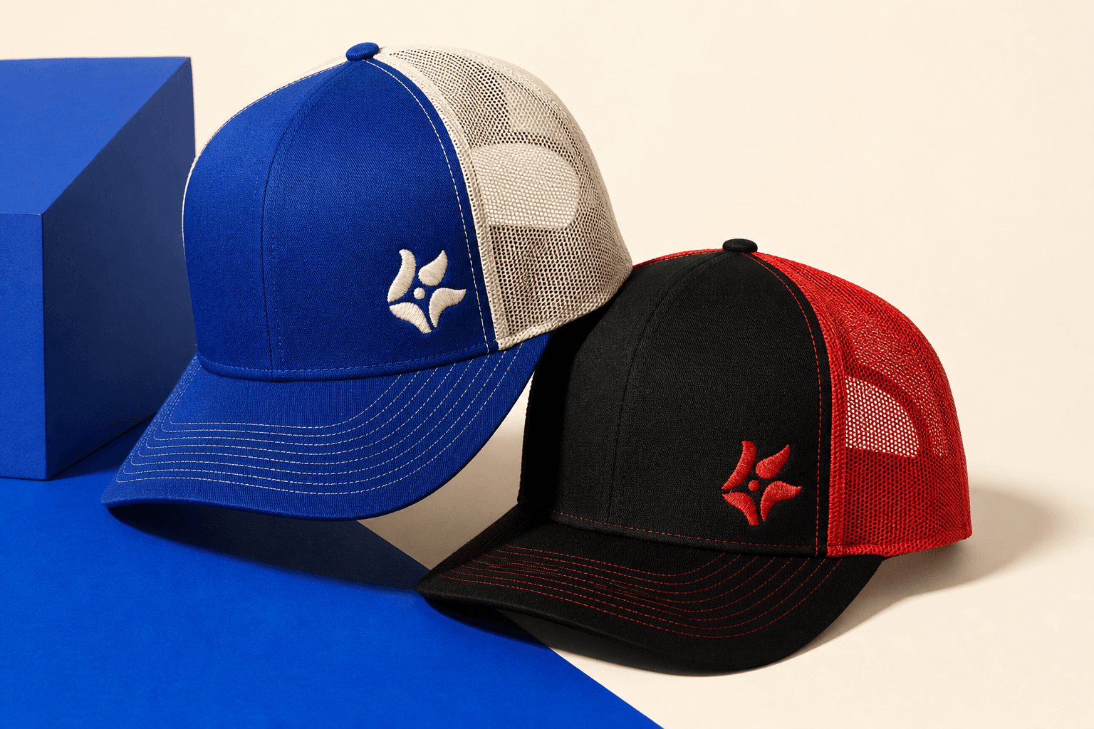 Two demo custom trucker caps in cobalt, bone, black and red